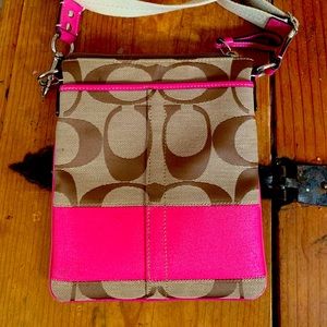 Women’s Pink and Tan coach purse